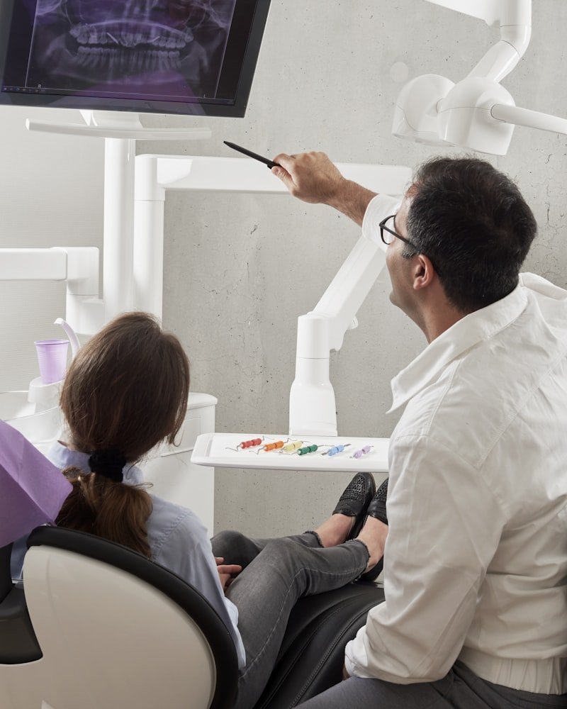 Ottawa dentist showing a patient her digital X-ray on a chairside monitor