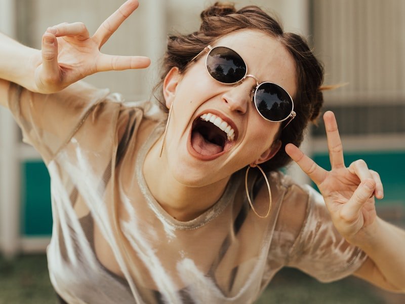 Confident woman laughing — joyful smile after cosmetic dental treatment