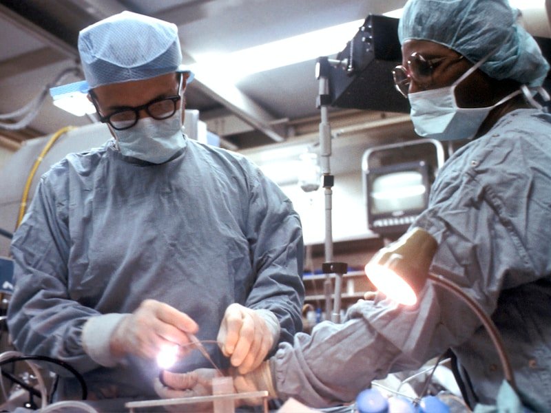 Surgical team performing a precise oral surgery procedure